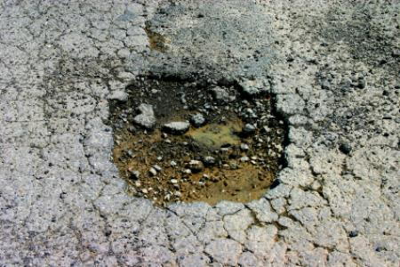 pothole driveway fix asphalt gravel pavement loose repair doityourself
