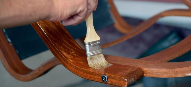 Staining a wood chair. 