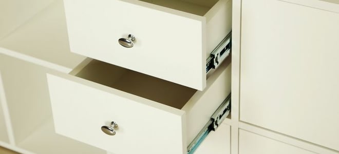 off-white drawers open in a unit