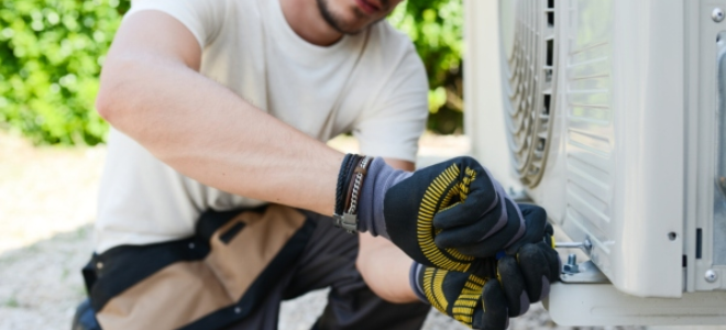 Repairman working on an air conditioner