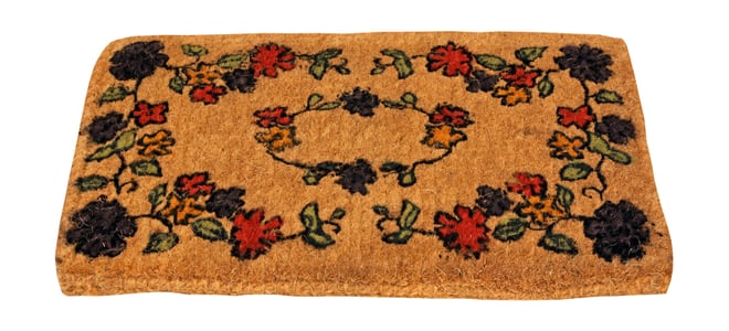 A doormat with bright colors on a white background.