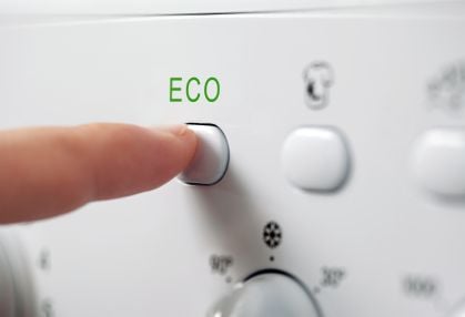 pushing the eco button on an appliance