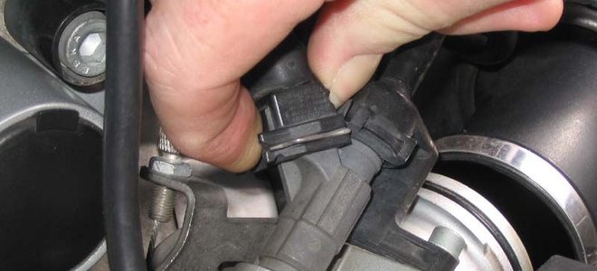 hand on a fuel injector