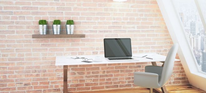 brick wall behind a desk