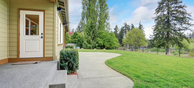 landscaped yard and concrete patio