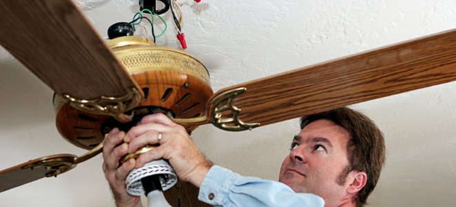 man installing a celing fan