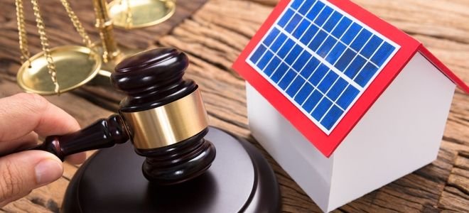 small solar house with judicial gavel