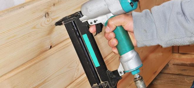 A pneumatic nailer and lumber.