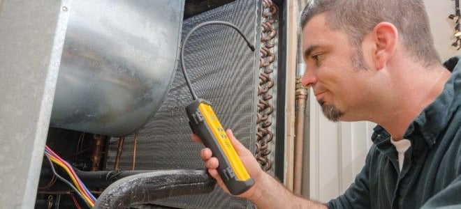 man working on an air conditioning unit