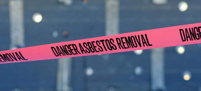 Red tape with the words "Danger Asbestos Removal" on it. 