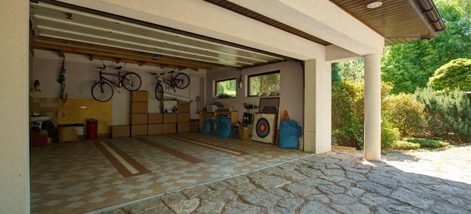 Bikes hung in a garage.