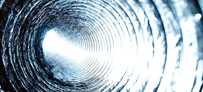 A close-up photo of the inside of a heating duct.