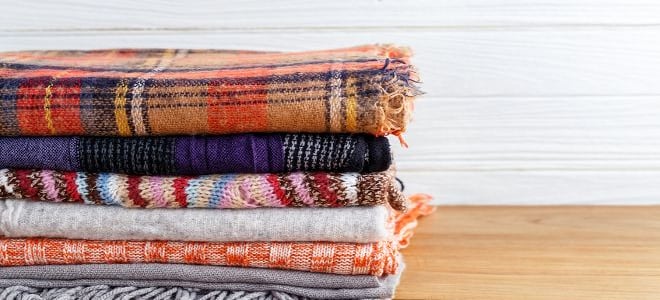 A stack of colorful blankets. 