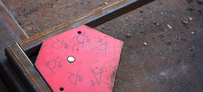 A red magnet square used for welding.