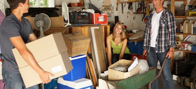 A family cleaning a garage.