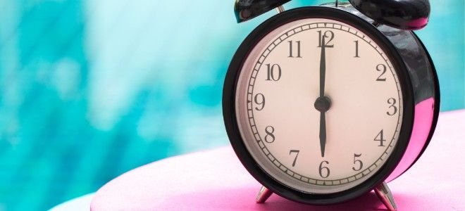 an old fashioned timer by a pool