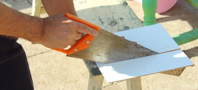 hand slicing tile with a panel hacksaw