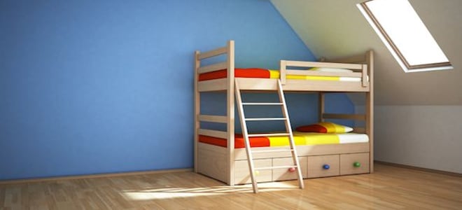 bunk bed with drawers in an otherwise empty room