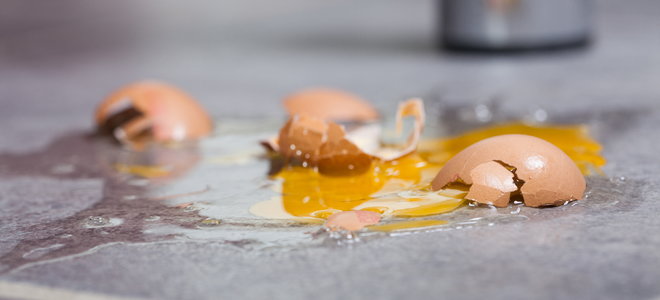 A cracked egg on the ground.