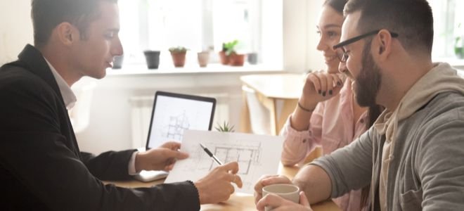 couple speaking with architect about home remodeling process