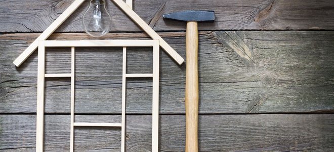 figure of a house, a hammer, and a tape measure