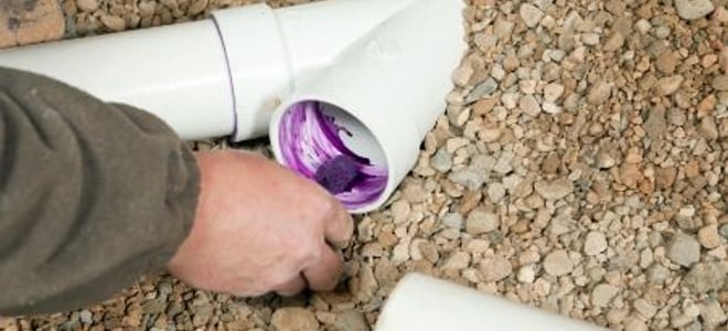 applying glue to pvc pipe in the ground