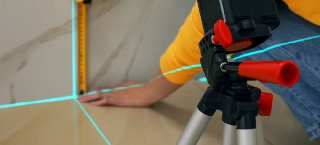 hands using laser measurement tool