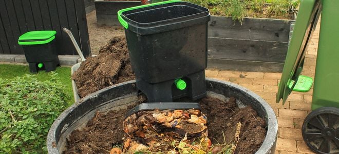 composting bin in garden soil