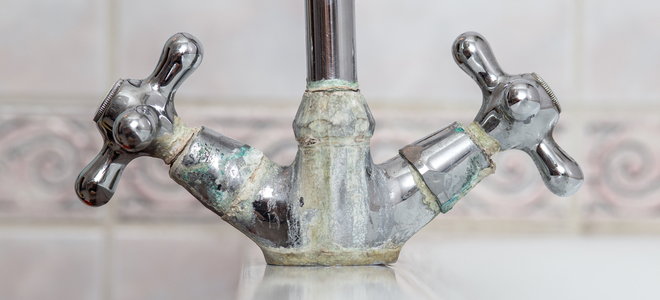 water faucet handles with corrosion damage