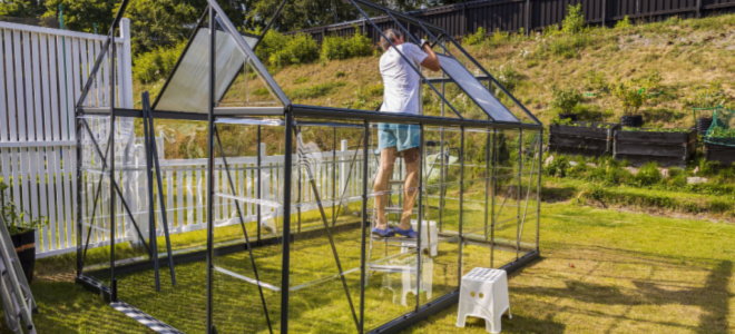 people building a greenhouse