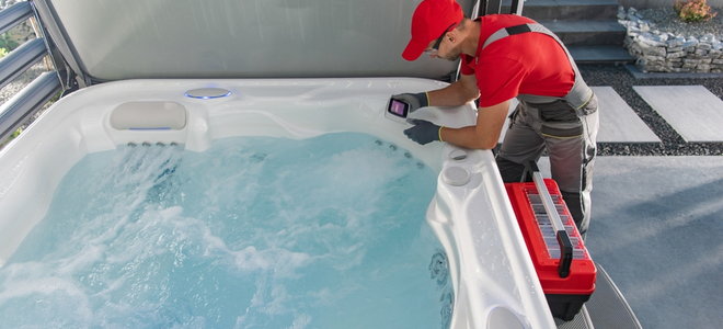 repair man working on hot tub