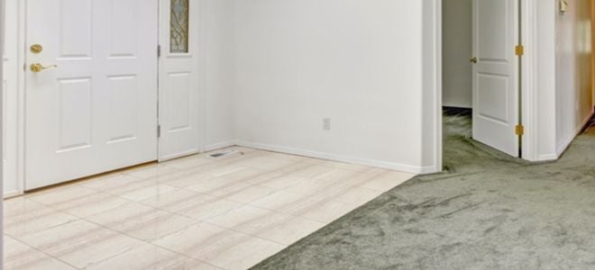 different flooring types meet near entryway