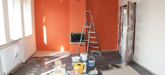 remodeling project with orange wall and fireplace