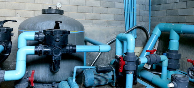A sand filter system with blue pipes