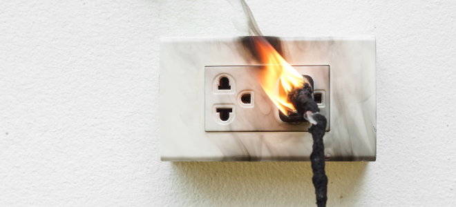 burning electrical outlet and plug
