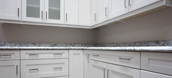 A kitchen with new cabinet hardware.