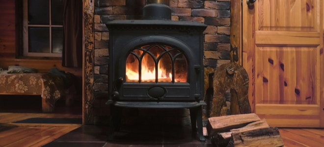 wood stove burning in a cabin