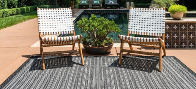 rug and chairs by pool