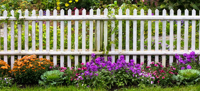 white picket fence in a garden