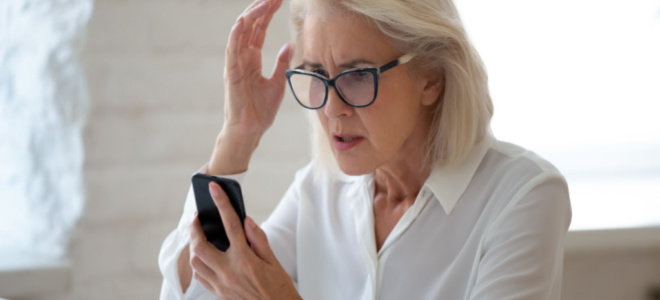 concerned woman looking at phone