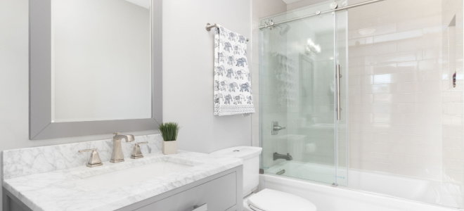 bathroom with glass sliding shower bath doors