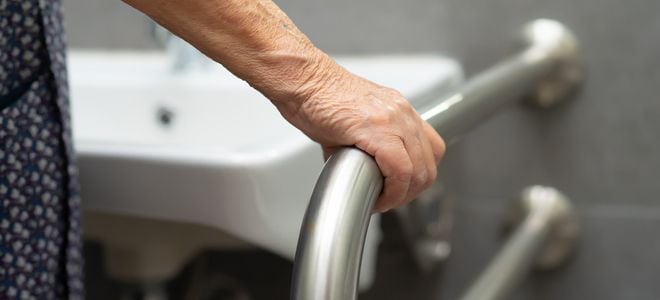 hand on a safety grab bar
