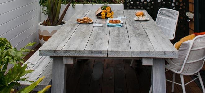 wood picnic table on patio