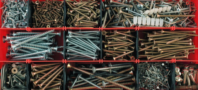 assorted nails and screws in a fastener toolbox