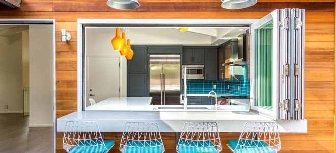 a modern kitchen with a folding open window