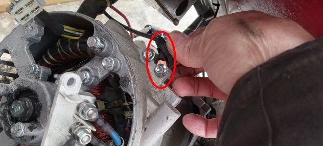 hand working with generator wiring