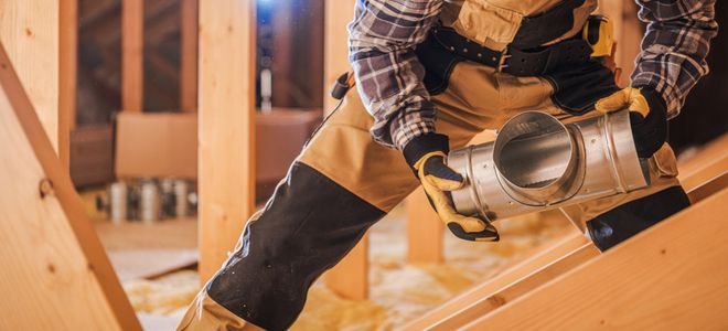 person installing ceiling venting