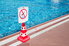 a red cone with a "do not dive" sign on it
