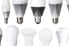 different kinds of LED bulbs lined up on a white background