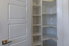 White corner pantry with shelves